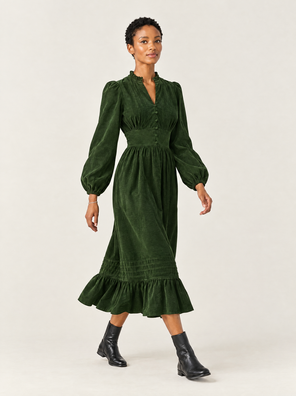 Ondine corduroy midi dress in Bottle Green, side and movement view