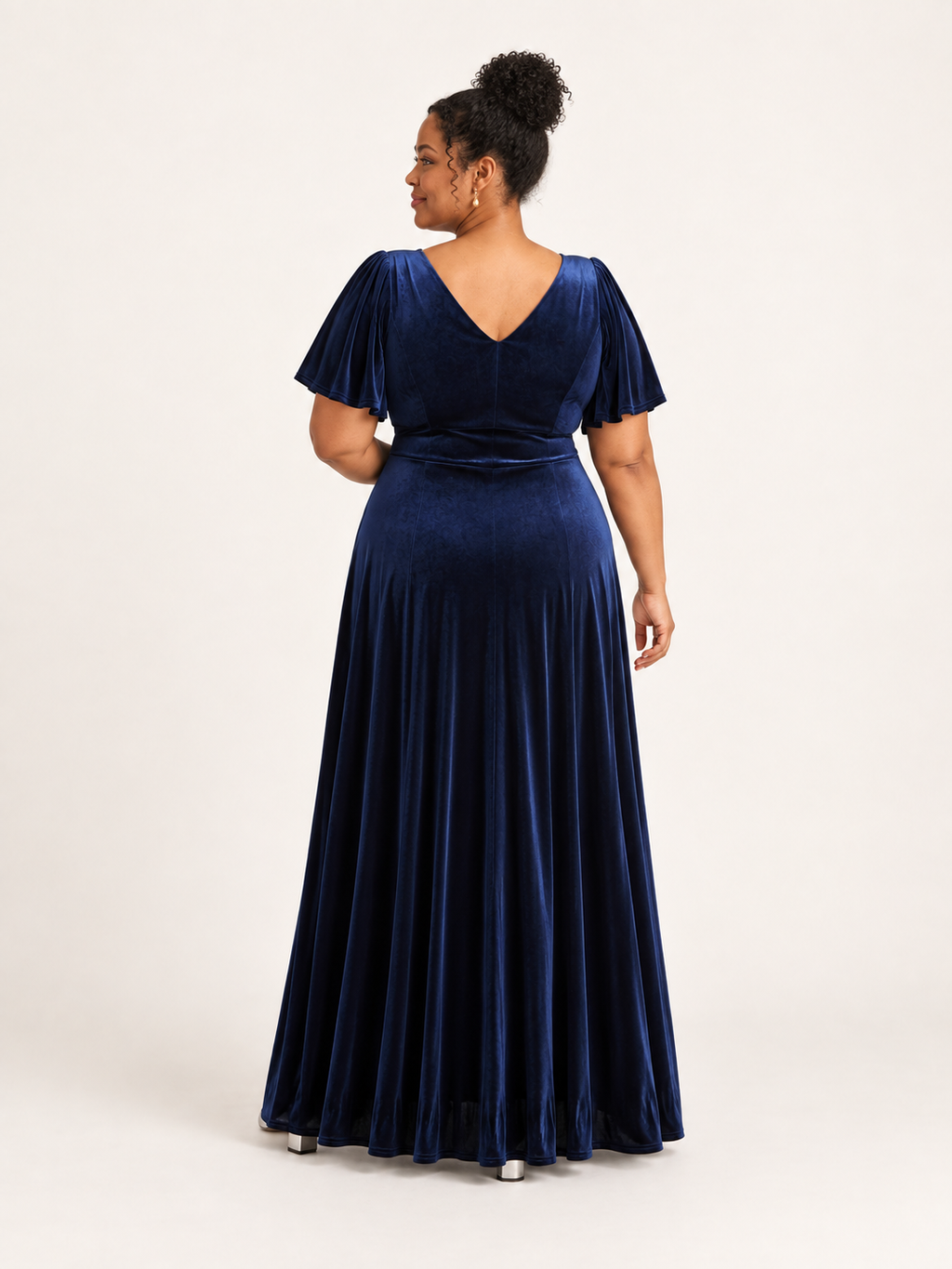 Back view of navy velvet maxi dress with V-shaped back neckline