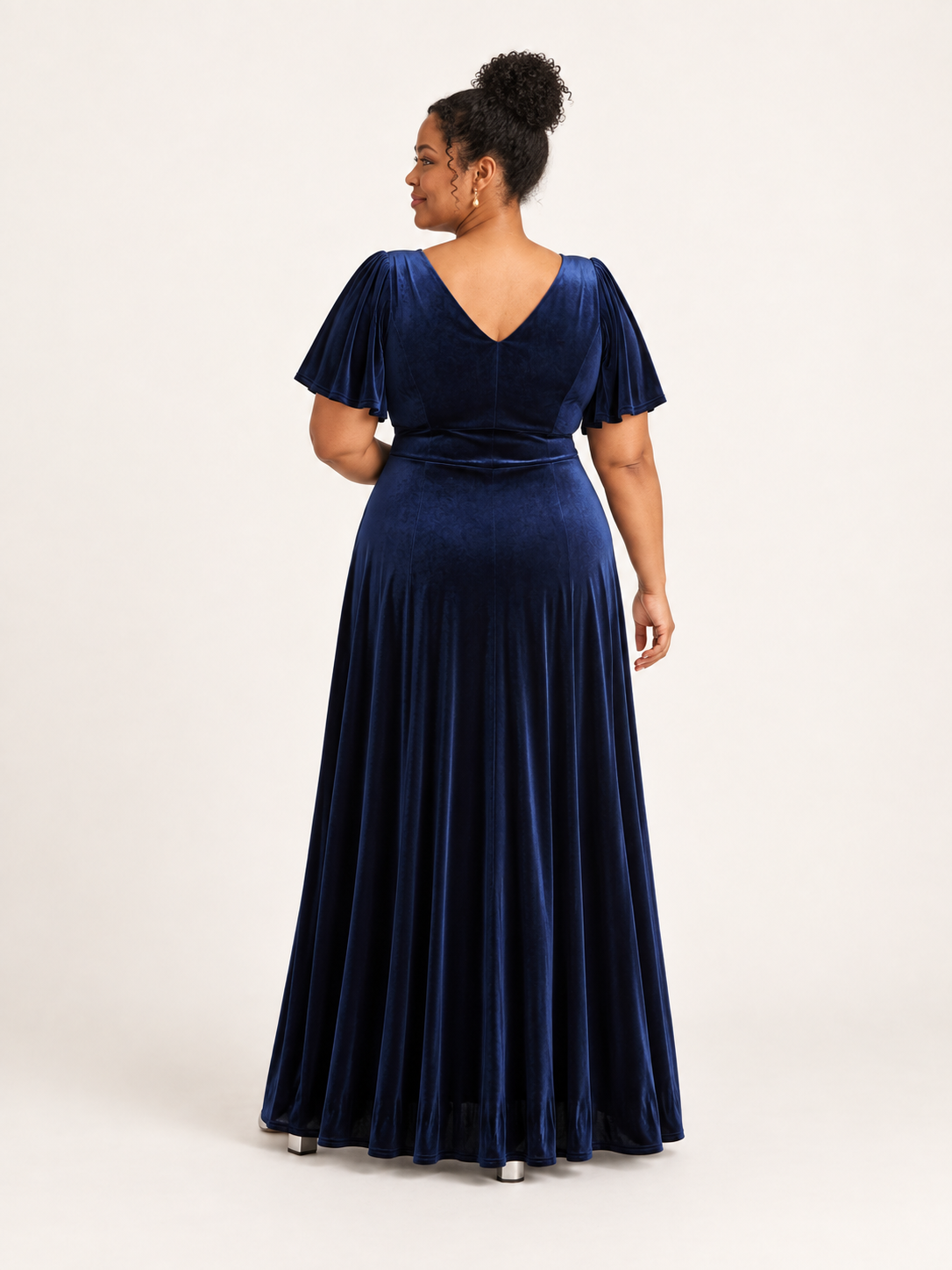 Back view of navy velvet maxi dress with V-shaped back neckline