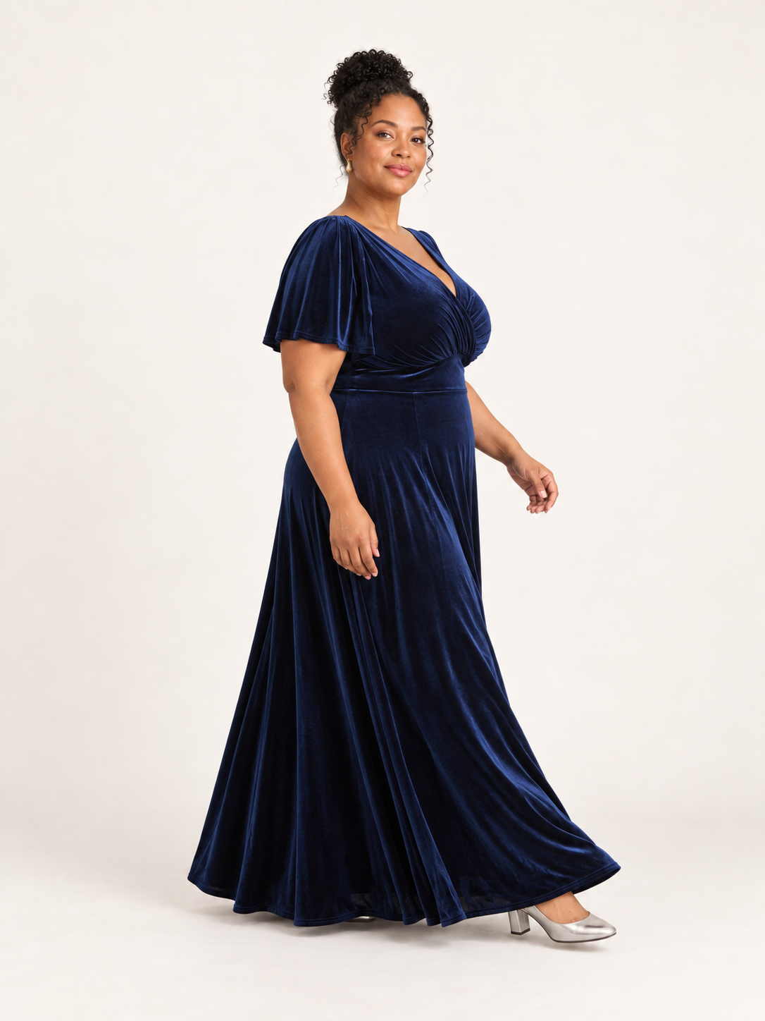 Side view showing the navy velvet skirt in movement