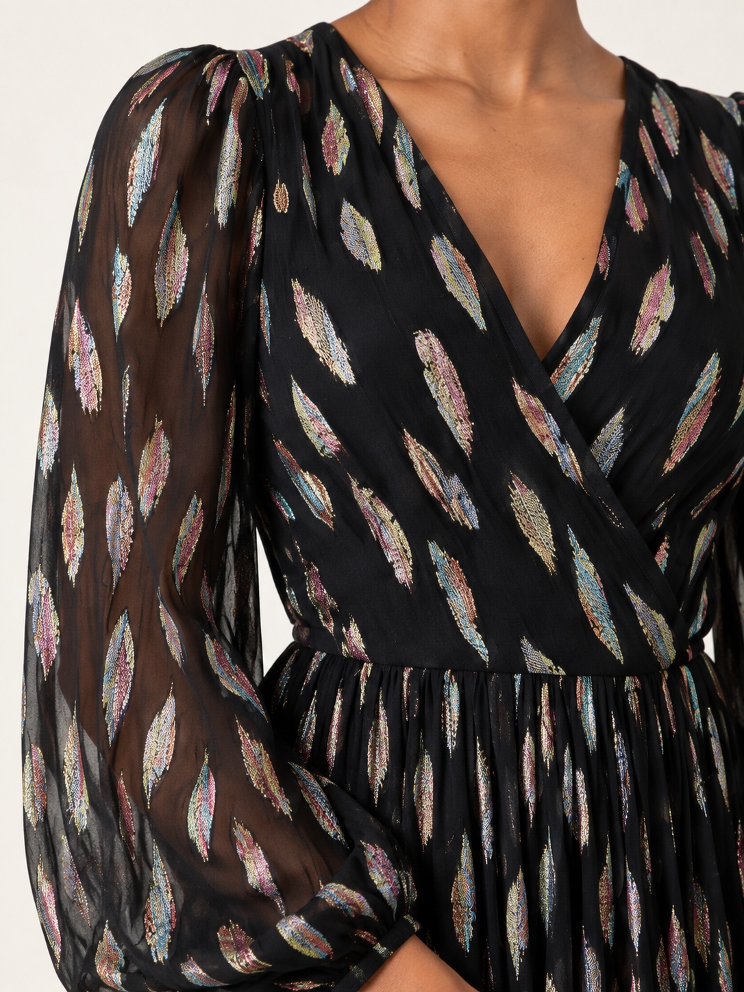 Black metallic V-neck long sleeve maxi dress — neckline and sheer sleeve detail