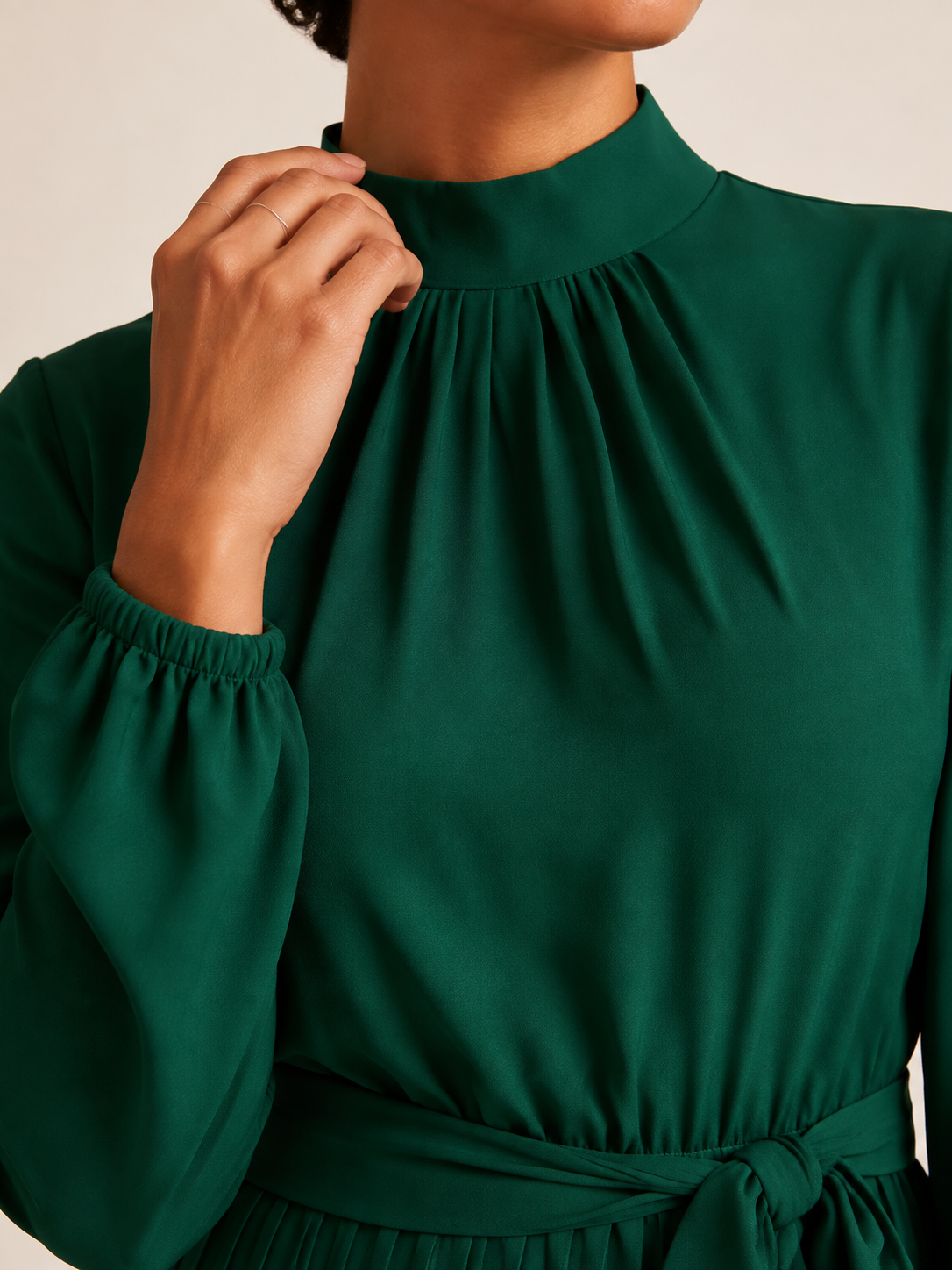 Gathered high neckline and sleeve cuff detail